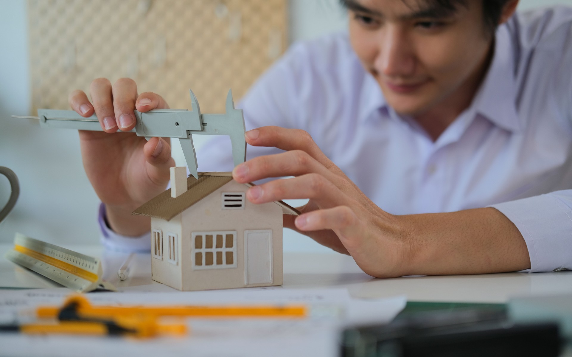 Architect working on project in office for architectural plan.